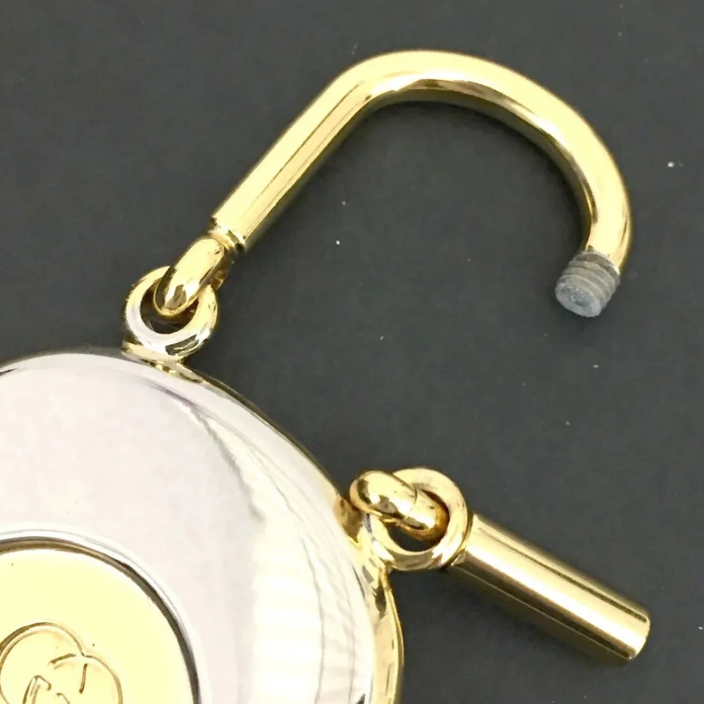 GUCCI INTERLOCKING G SILVER GOLD TONE KEY RING CHARM/UT1930 (UNISEX).